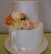 Wedding cake with fresh flowers.