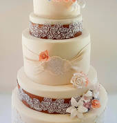 5 tier wedding cake with handmade lace and sugar flowers