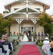 stunning ceremony setting with white chair covers and mint sashes