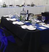 Regal Black & Blue theme, using black lycra chair covers and royal blue sashes