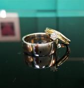 mens white gold wide wedder and woman's classic solitaire bridal set with fitted wedder